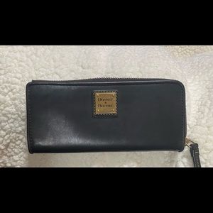 Dooney and Bourke zip clutch wallet. Used, color is Brown Tomorrow